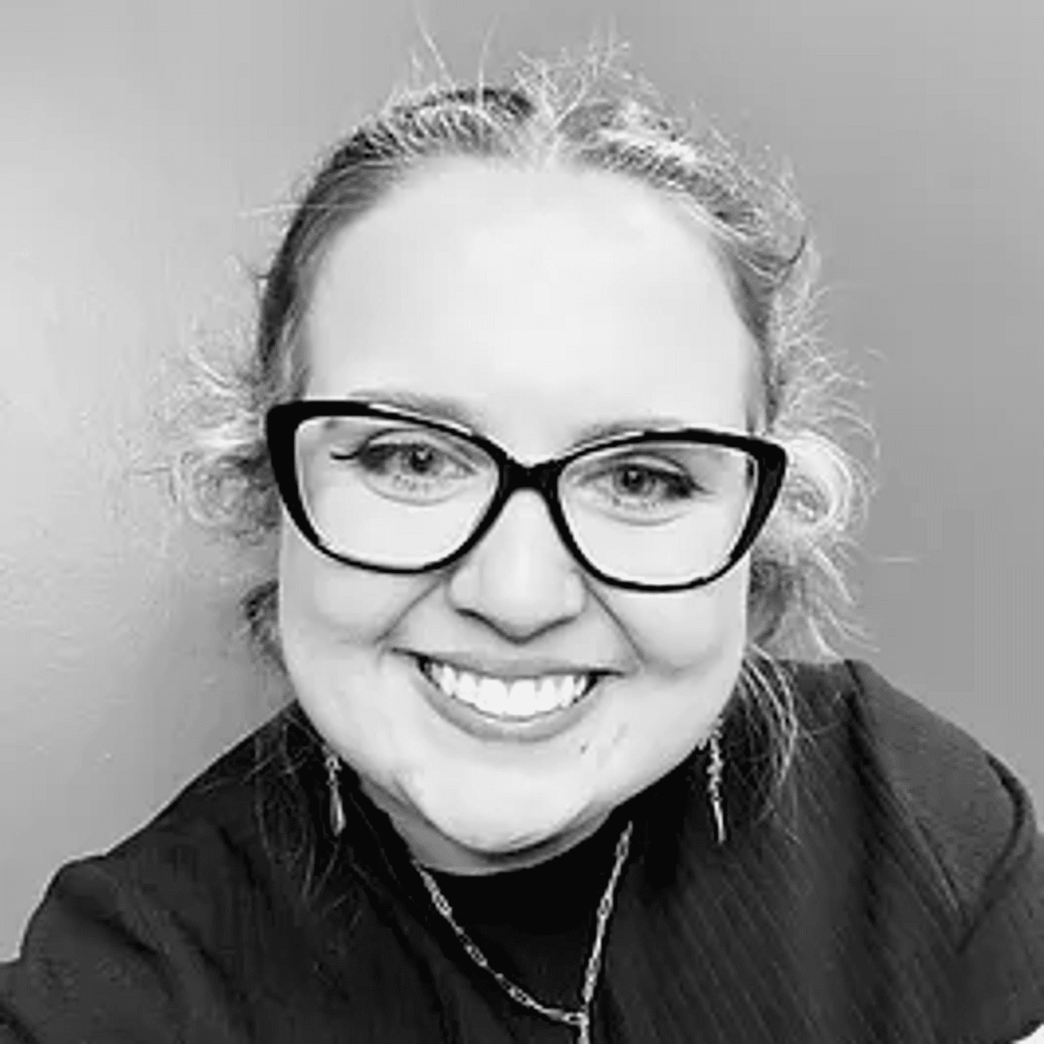 Portrait of Olivia, a professional stylist at Good Vibes Salon, showcasing their expertise and style.