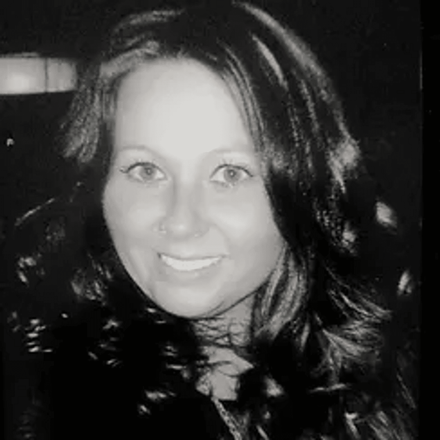 Portrait of Teri, a professional stylist at Good Vibes Salon, showcasing their expertise and style.